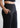Side pocket and waistband close-up, black trousers