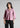 Woman wearing blush lilac textured shirt with black trousers