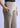 Side pocket and waistband close-up, clay beige trousers