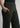 Side pocket and waistband close-up, dark olive trousers