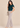Teal blue pleated top with flutter sleeves, left side