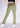 Golden olive flare pants, walking pose