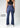 Navy flare pants, front view with flare cut text