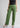 Sage green cotton trousers, angled front view