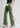 Sage green cotton trousers, with feature labels