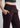 Side pocket and waistband close-up, wine trousers
