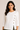 Flurr Mira asymmetric top close-up showing cotton fabric, button detail and refined finish