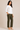 Flurr Mira asymmetric top for women in left side view, showing the asymmetric silhouette and 3/4 sleeves