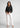 Black formal shirt with white trousers, full-length office look