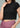 Black ribbed crop top, close-up