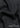 Black ribbed fabric close-up with Ribbed Texture text