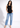 Black sleeveless top with blue jeans, full length