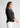 Black shirt-style top for women, side view