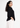 Black V-neck top, back view from the side