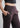 Side pocket and waistband close-up, brown trousers