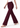 Burgundy plum trousers in mid-stride, side view