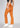 Caramel flare pants, with feature labels