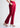 Cherry red bootcut pants, angled front view