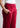 Side pocket and waistband close-up, cherry red trousers