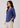 Dusty indigo linen top, angled view, hand in pocket