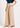 Flurr beige wide leg pants close-up showing fabric and tailoring details