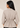 Back view of the beige Waist Tie-up Shirt Top showing the collar, gathered waist, three-quarter sleeves and flared hem.