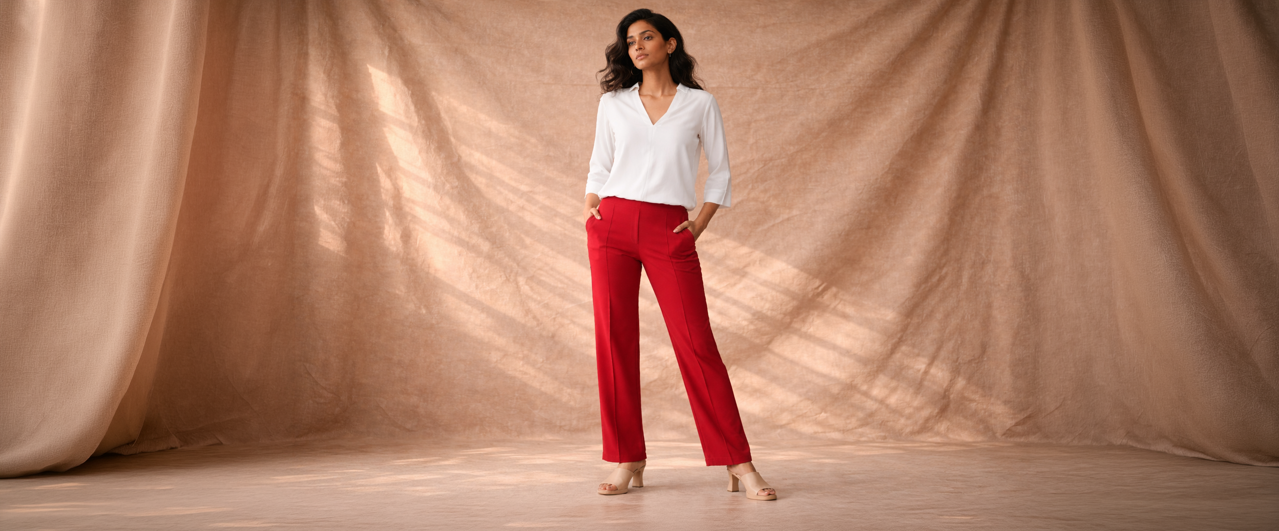 Woman in white top and red trousers – Effortless. Elevated. Everyday. Shop Workwear and Activewear at Flurr
