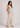 Flurr Linen Blossom floral top for women, right side view showing the relaxed fit and curved hem