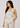 Flurr linen ivory floral top with V-neck and yellow and lavender floral print, close-up view