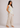 Flurr linen ivory floral top showing the relaxed silhouette and floral print from the left side