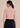 Flurr soft pink bow tie neck top, back view