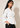 Angled view of the white Waist Tie-up Shirt Top showing the notched collar, three-quarter sleeves and front waist tie.