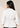 Back view of the white Waist Tie-up Shirt Top showing the collar, gathered waist, three-quarter sleeves and flared hem.