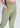 Golden olive flare pants, pocket close-up