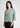 Woman wearing golden olive textured shirt with black trousers