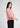 Light pink shirt-style top for women, side view