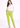Woman in lime green straight pants and white shirt