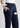 Navy trousers close-up with pintuck and pocket labels