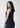 Navy sleeveless top, back angle over the shoulder