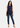Navy sleeveless top with blue jeans, full length