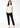 Off-white printed work top with black trousers, full length