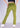 Pickle green flare pants, angled front view