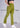 Pickle green flare pants, with feature labels