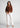 Rust formal shirt with white trousers, full-length office look