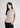 Soft beige textured shirt top, angled front view