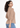 Soft beige V-neck top, back view from the side