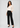 Soft ivory work top with black trousers, full length