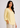 Soft yellow V-neck linen top, side view