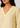 V-neckline close-up, soft yellow linen top