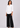White shirt top with black trousers, full length